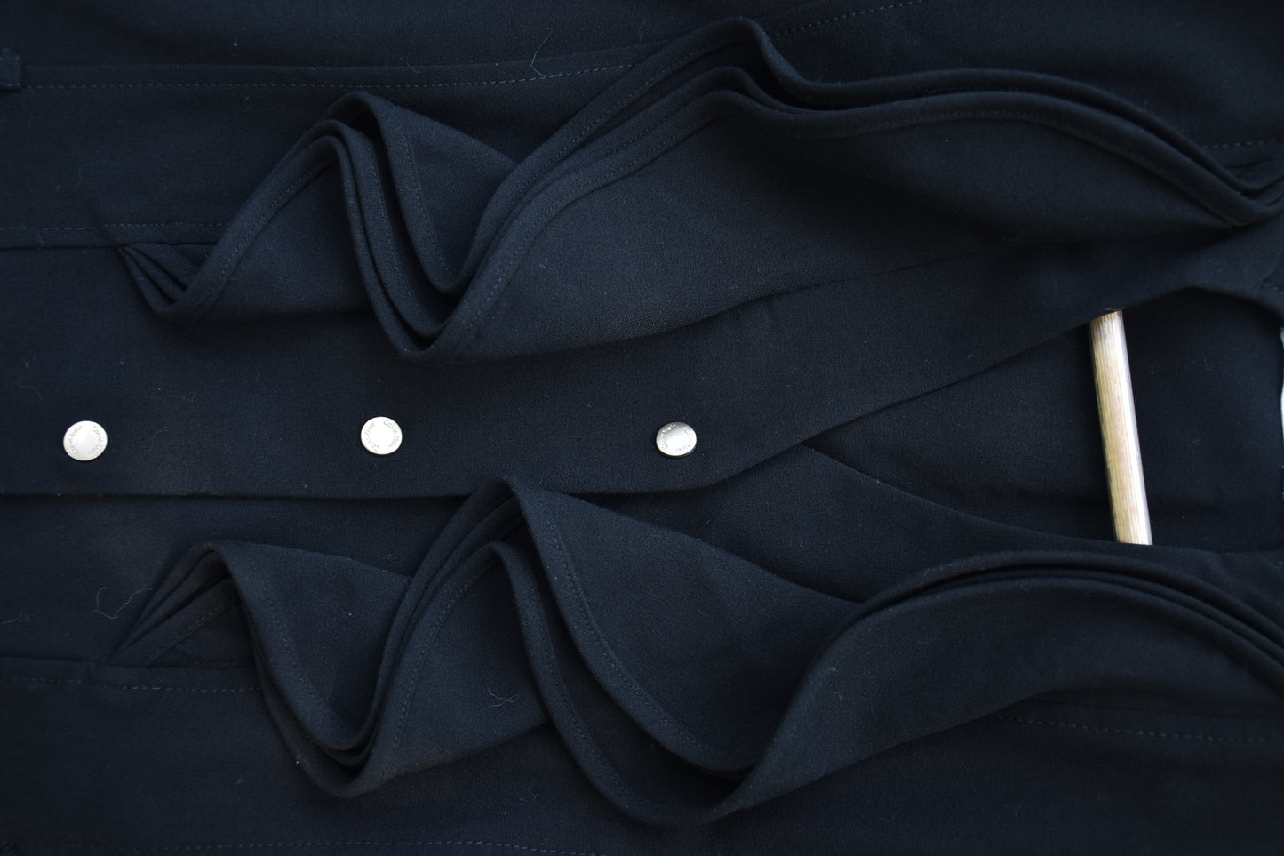 Sleeveless Black Dress with Pleats and Ruffle Trim Lapel