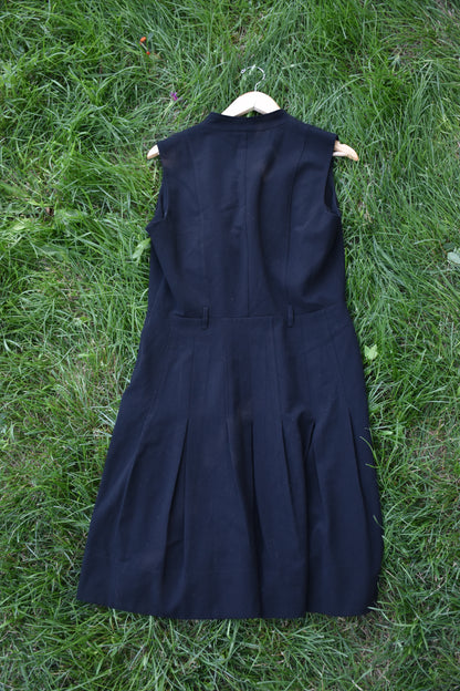 Sleeveless Black Dress with Pleats and Ruffle Trim Lapel